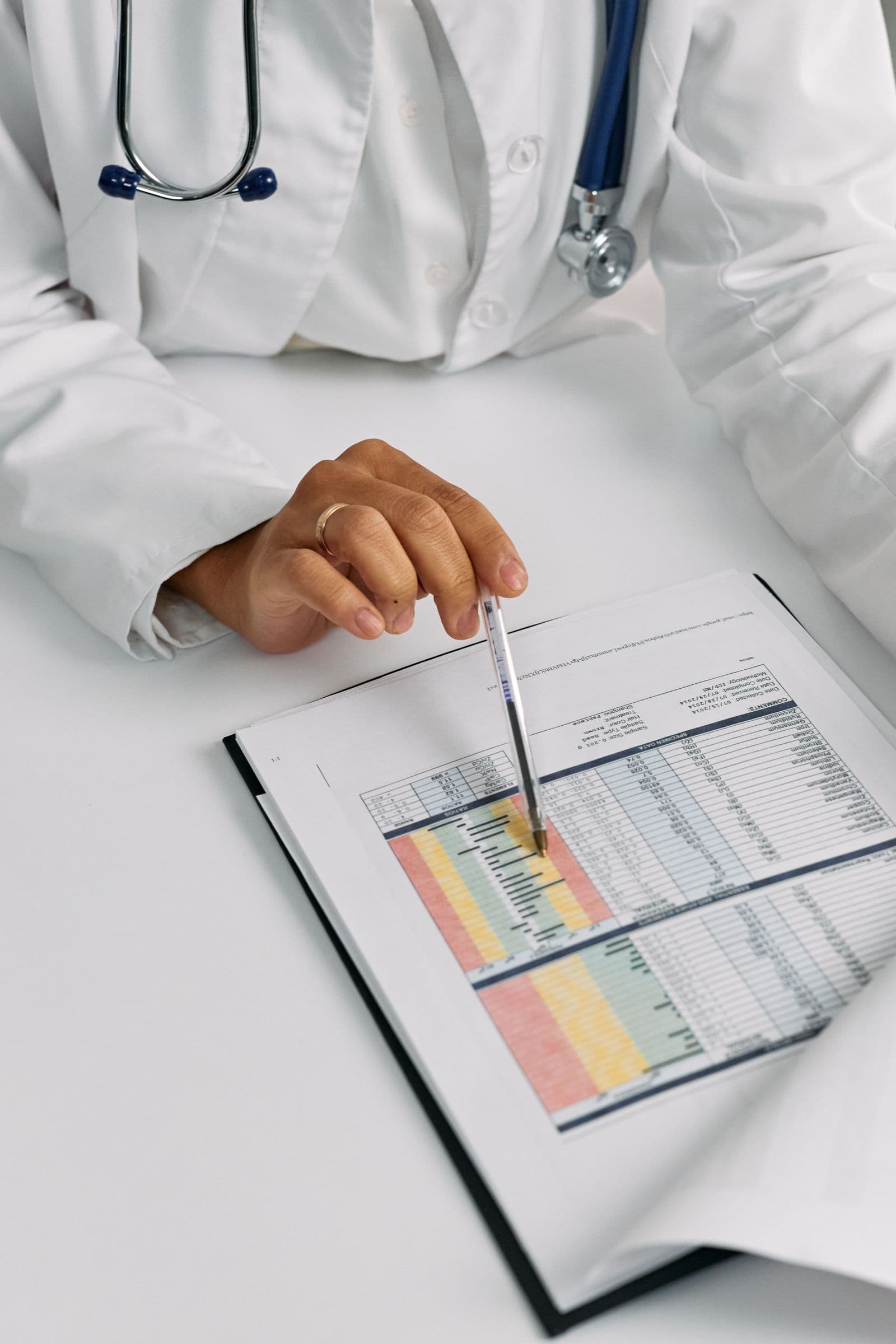 A physician reviewing a detailed medical chart