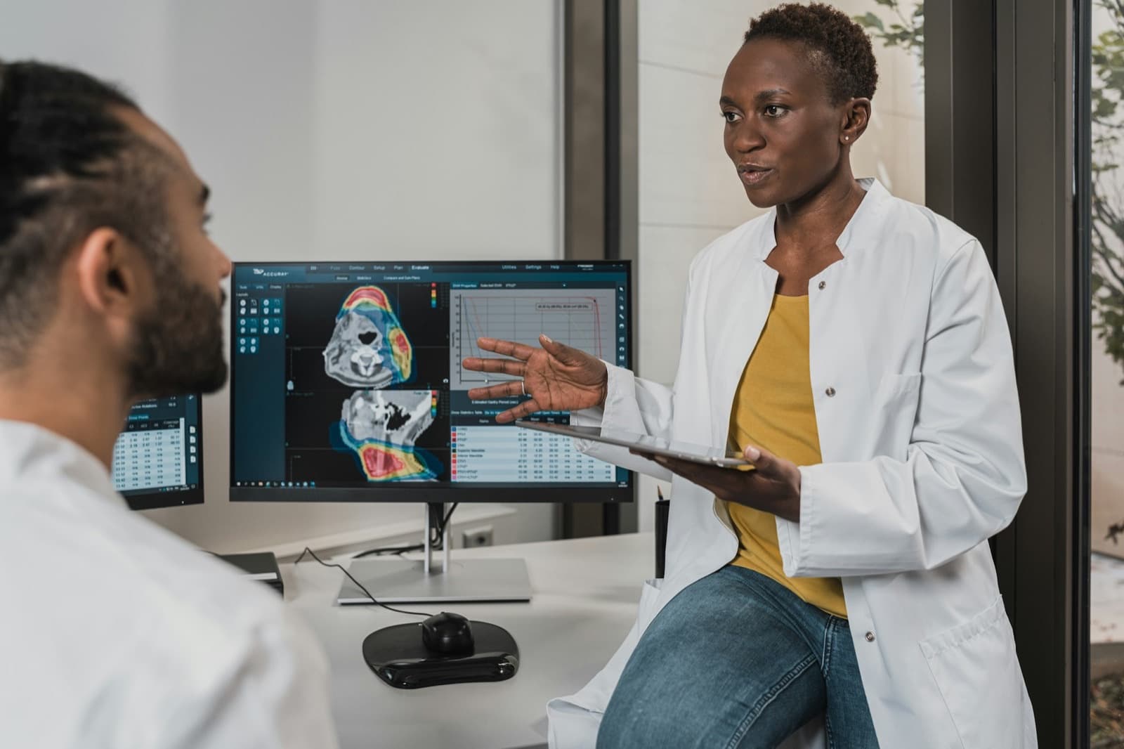 Two clinicians reviewing medical imaging together