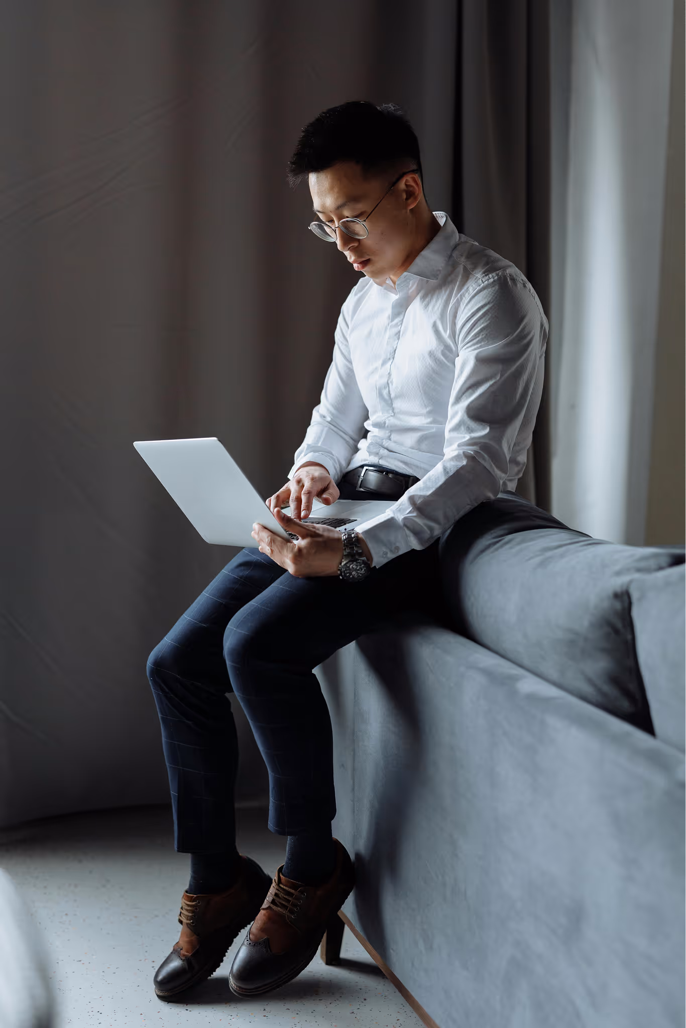 A professional working on a laptop